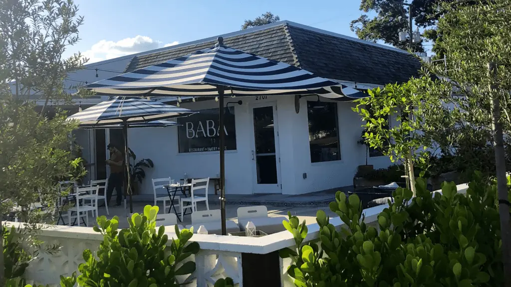 Exterior of a restaurant with a white awning