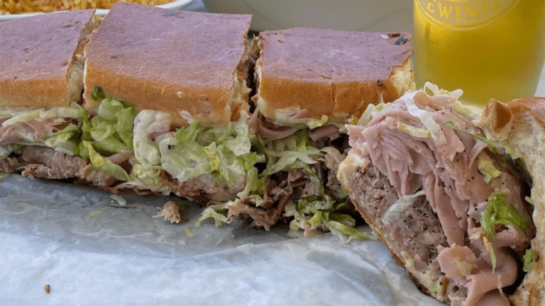 a giant Cuban sandwich cut into quarters