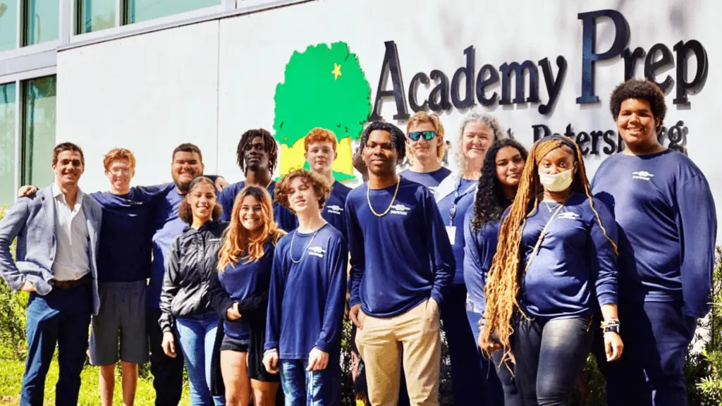 A group of students outside Academy Prep