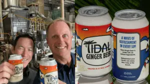 Two people smiling alongside ginger beer cans