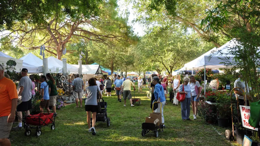 A group of vendor tents at a large park 