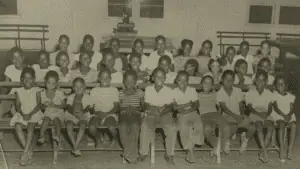 Black children smile for the camera at the Melrose Park YMCA.