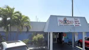 Exterior of a seafood restaurant with a sign that reads Sea Hags