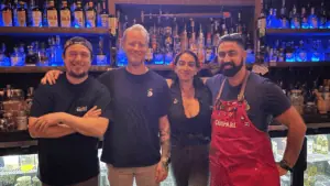 The staff at The Ship's Hold behind the bar