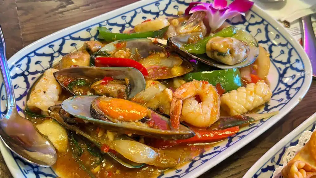 a basil seafood dish with shellfish and veggies