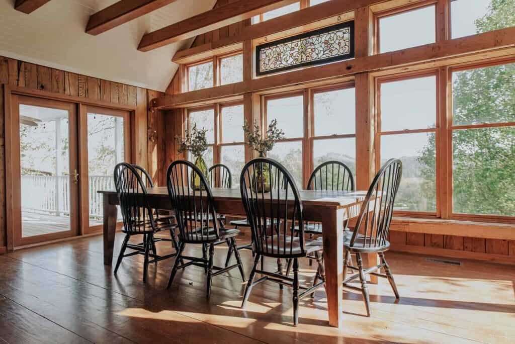 interior of a dining room with a wrapped around window overlook