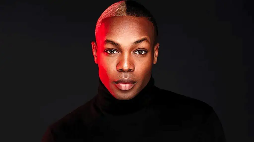 Todrick Hall stares straight into the camera wearing a black turtleneck.