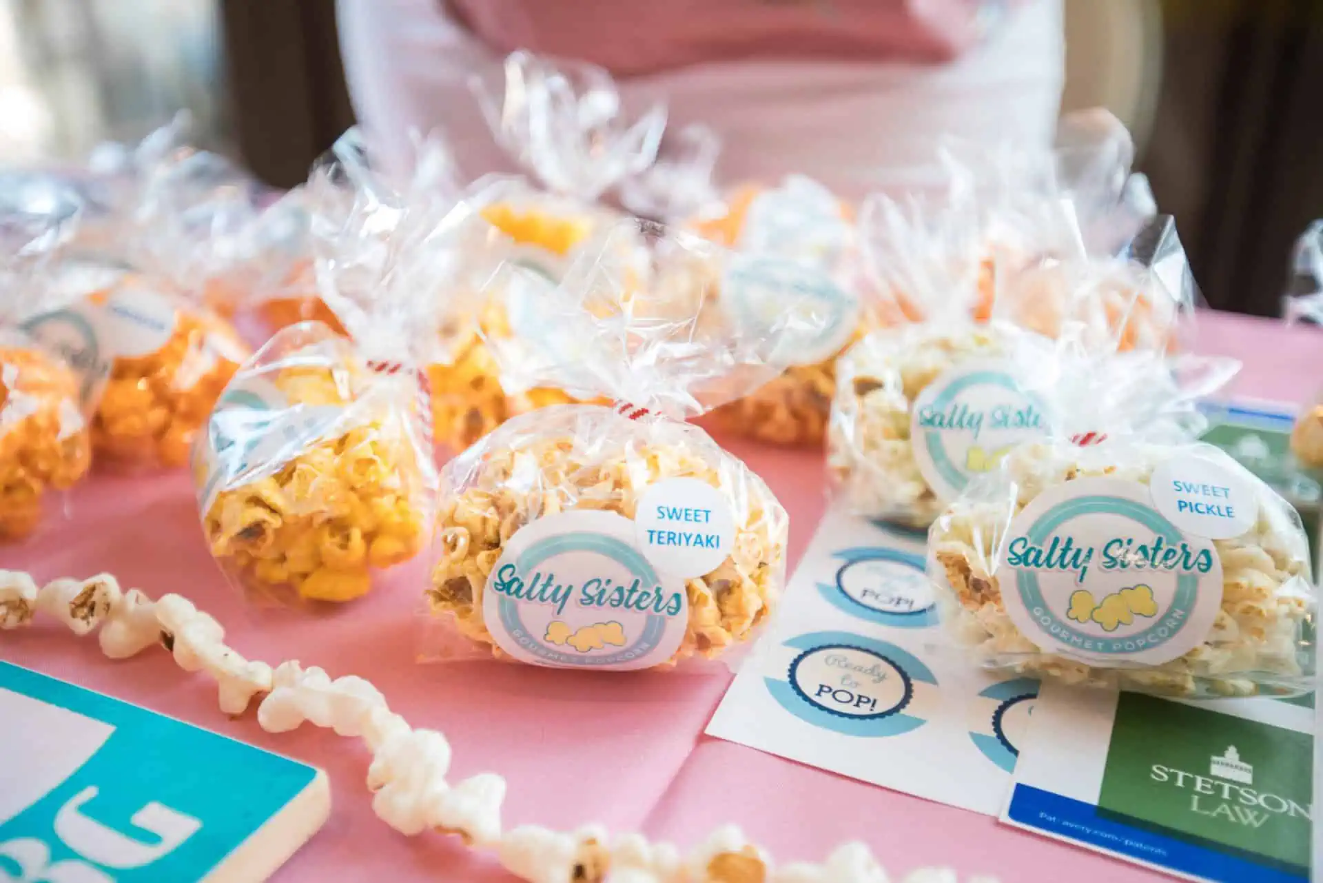 bags of salty sisters popcorn on a table