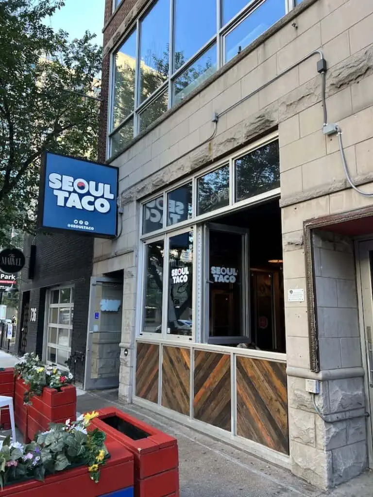 Seoul Tacos exterior with sign and outdoor seating