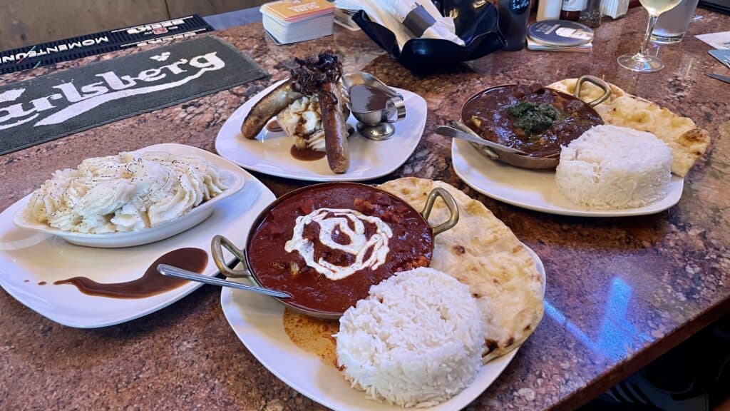 Four plates of British food at Studio Pub