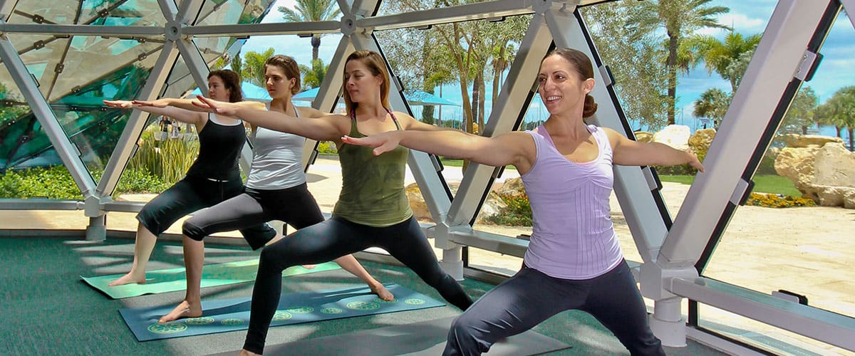 Women doing yoga at the Dalí