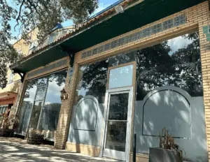 Exterior of a building with large glass doors.