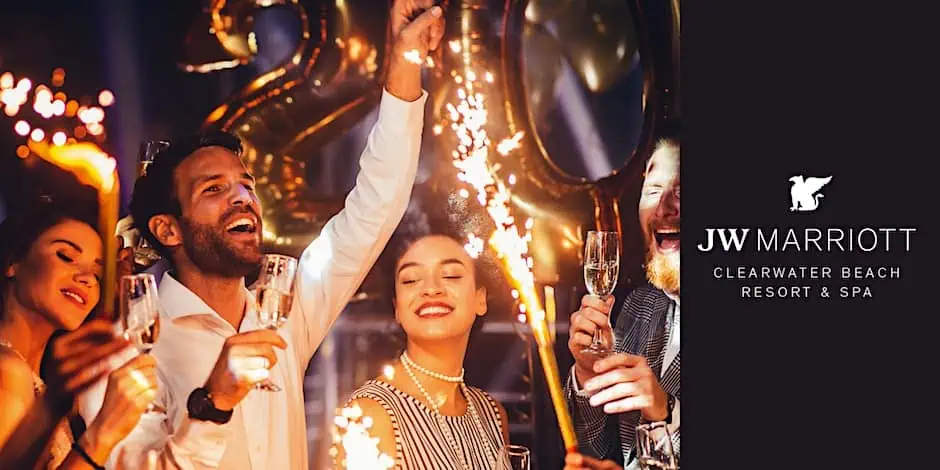 People celebrating NYE with champagne and sparklers