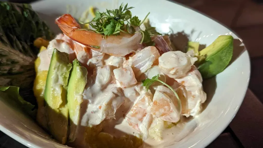 photo of seafood in a dish with avocado and shrimp