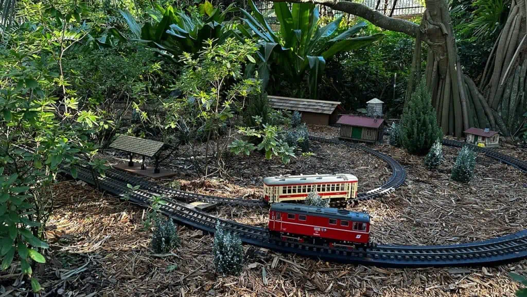 a model train display in a garden