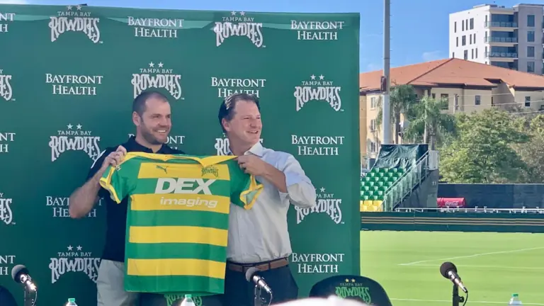 The Rowdies new head coach being presented with a jersey
