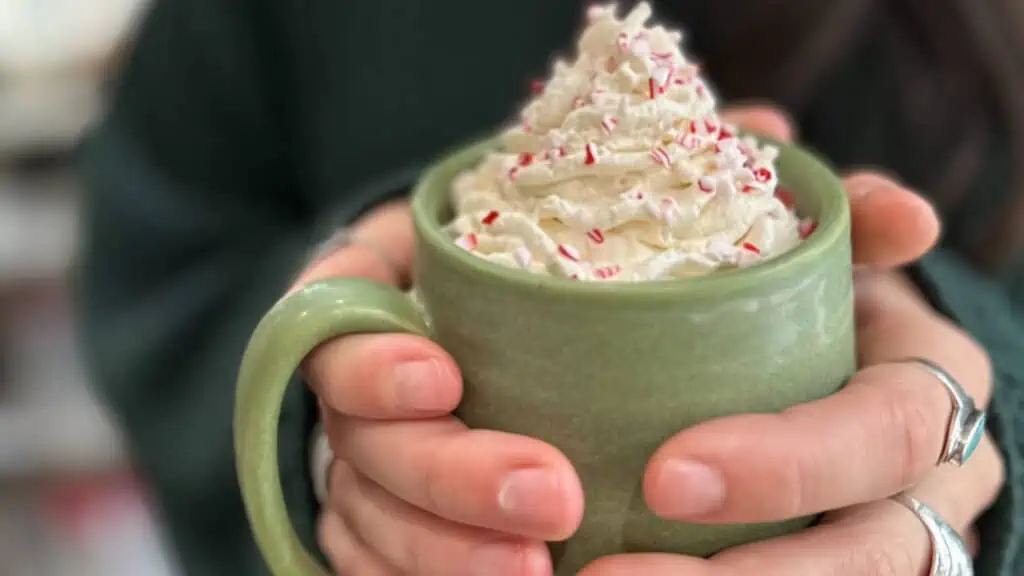 a peppermint mocha from craft kafe held by two hands