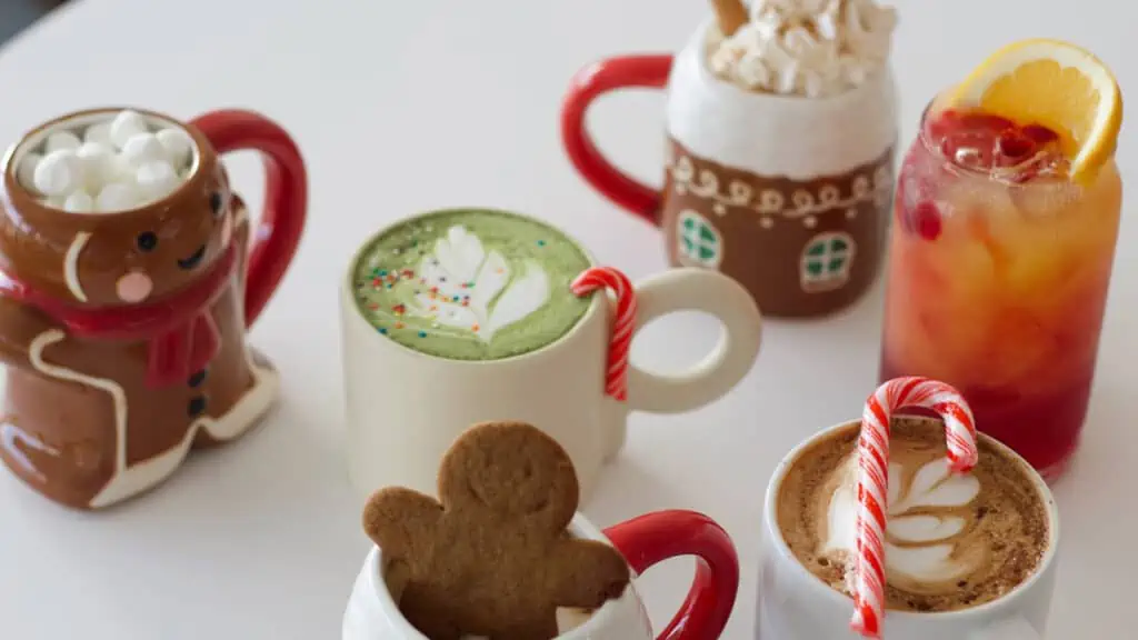 an array of holiday drinks on a white cafe table