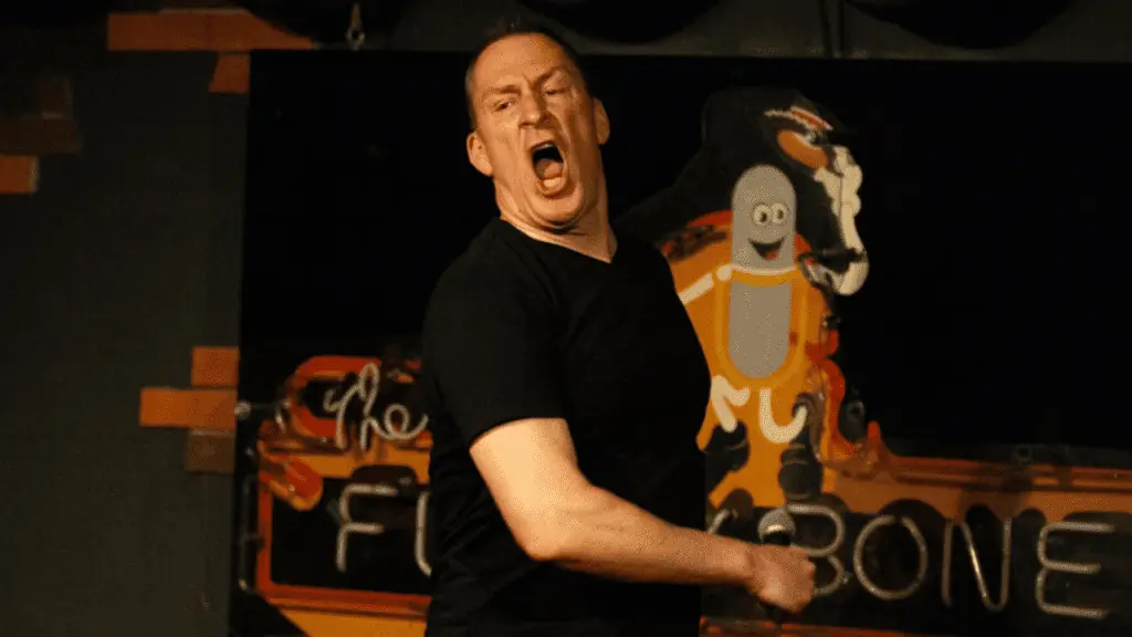 A comedian performing on stage