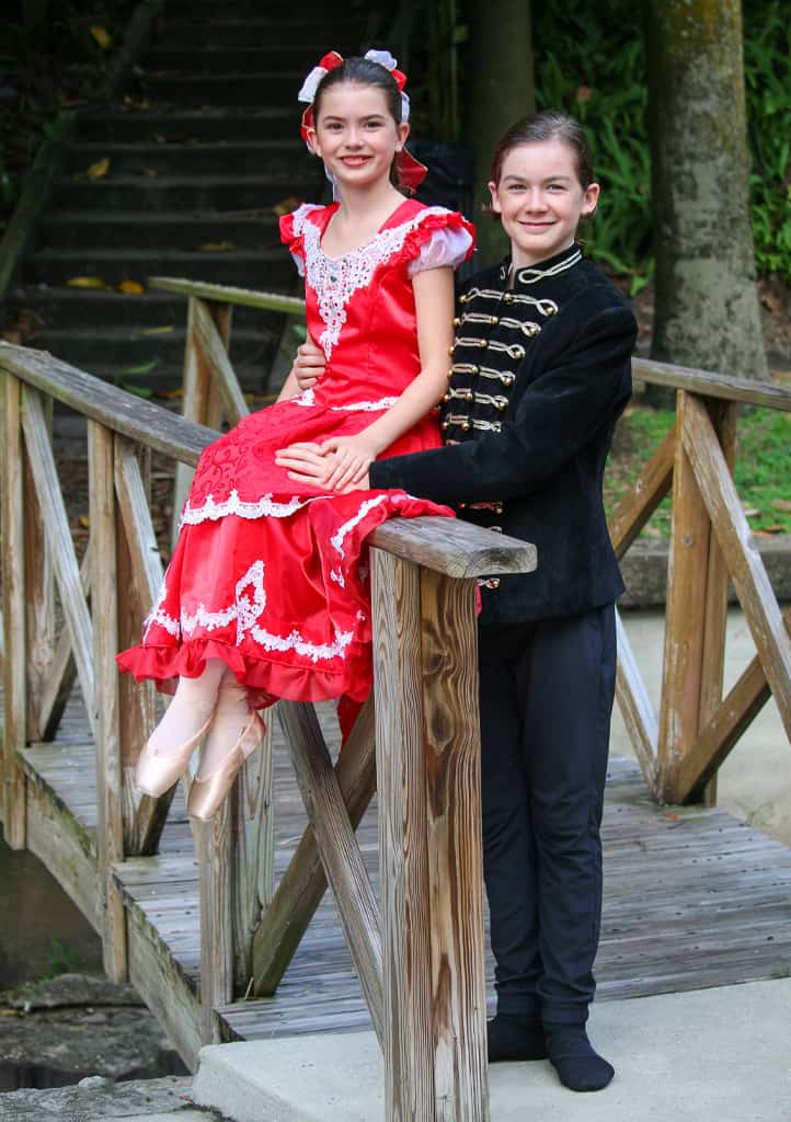Two ballerinas dressed in Nutcracker outfits