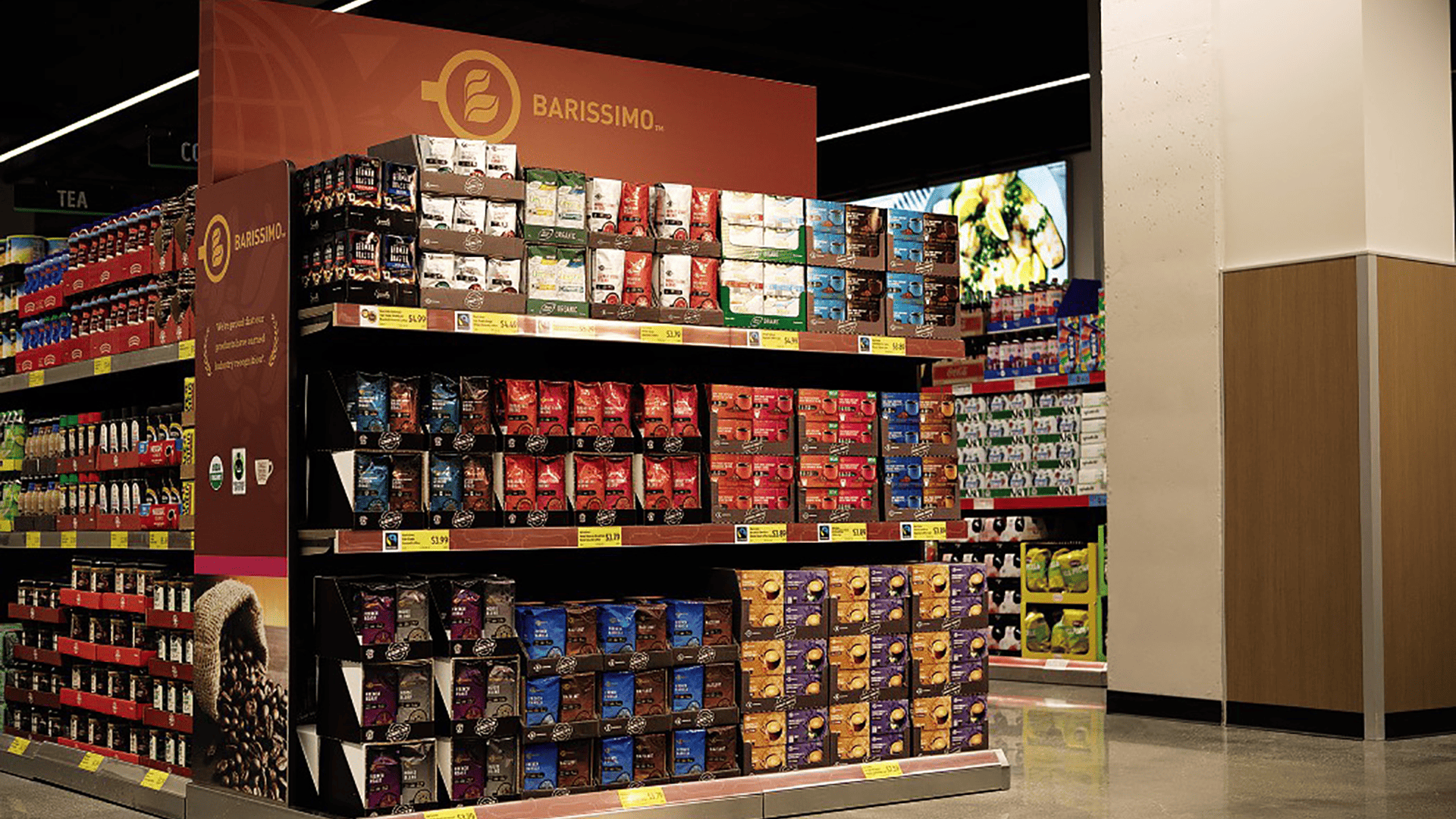 inside a grocery store with coffee arranged on shelves