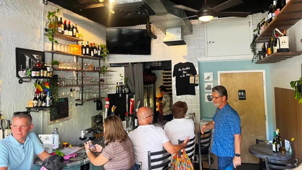 five bar patrons sit inside Bar Chinchilla, the smallest bar in st pete