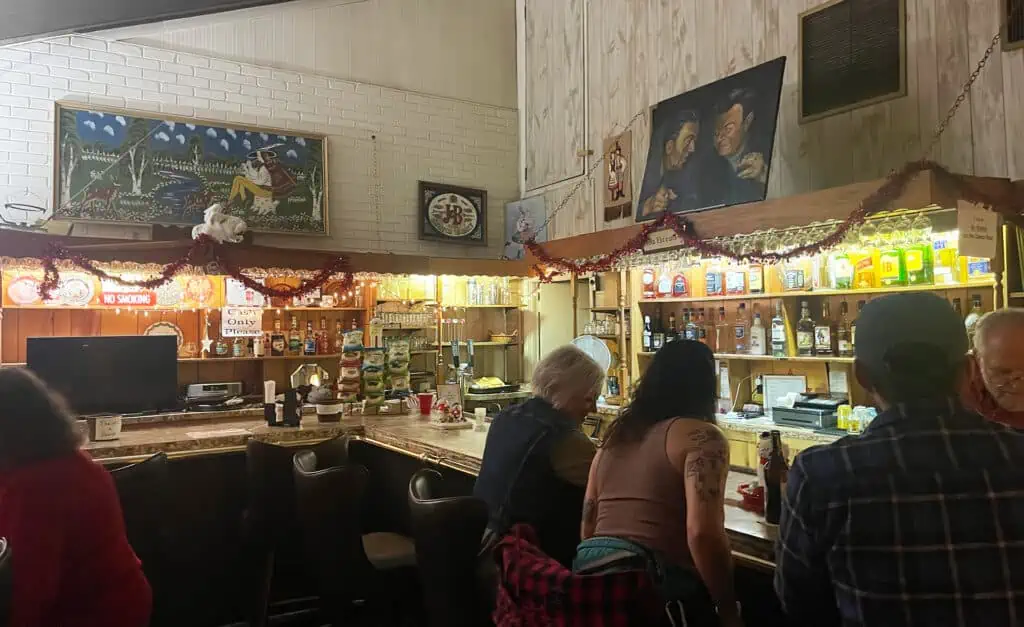 an L shaped bar inside a historic club