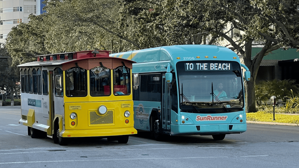 Two trolleys side by side. One is light blue and the other is yellow