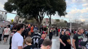 people standing in line outside of a stadium