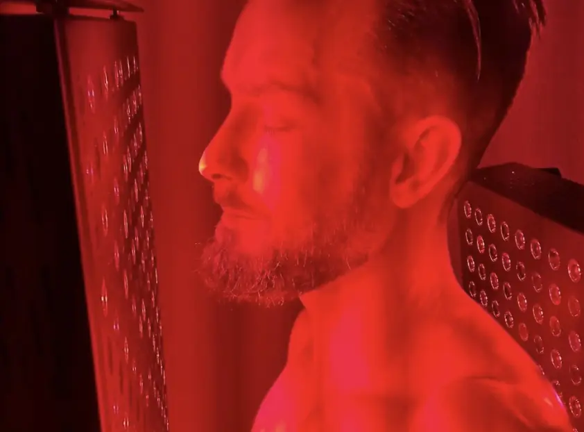 A person in red light therapy