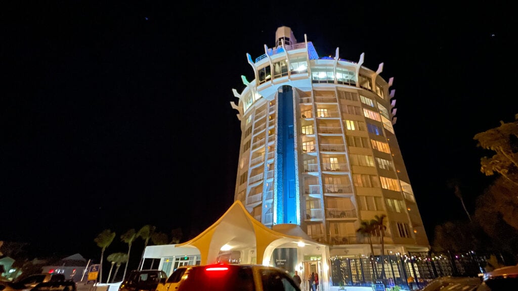 the exterior of the bellwether beach resort at night