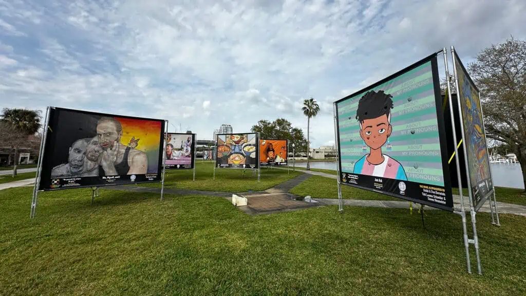 a waterfront park is playing host to an outdoor art exhibit