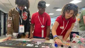 students build circuit boards on a field trip