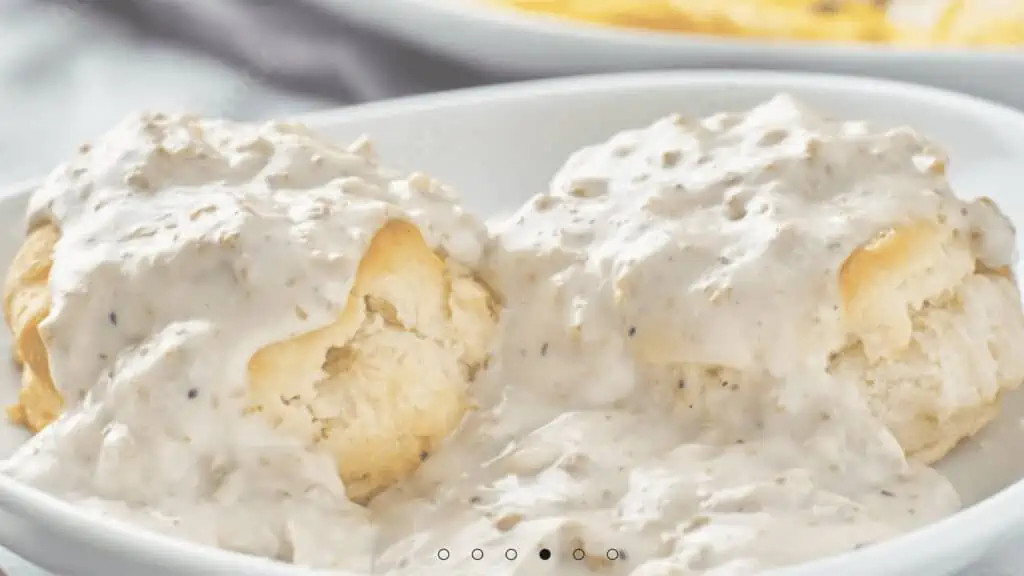 Biscuits covered in white sausage gravy
