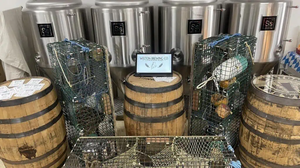 Multiple wooden barrels arranged around crab traps