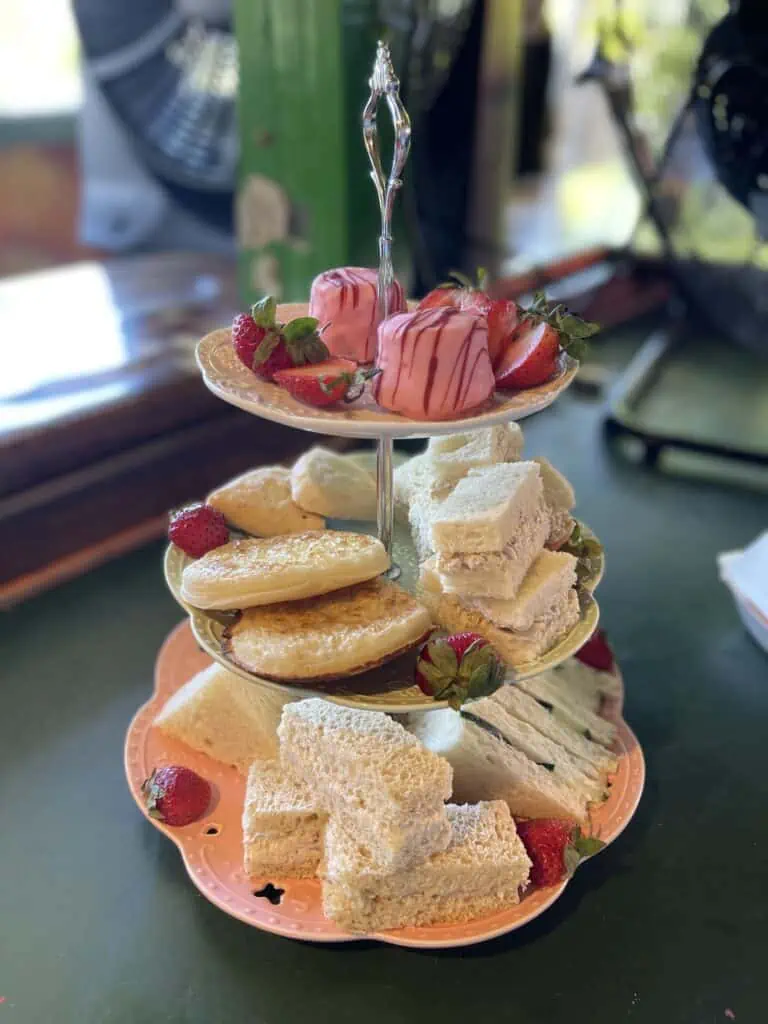 array of finger food, min sandwiches and such, arranged on a tower