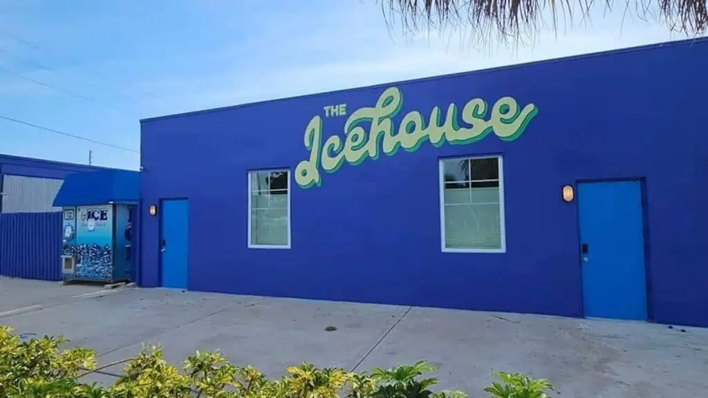exterior of a royal blue building with the words The Icehouse written in light green