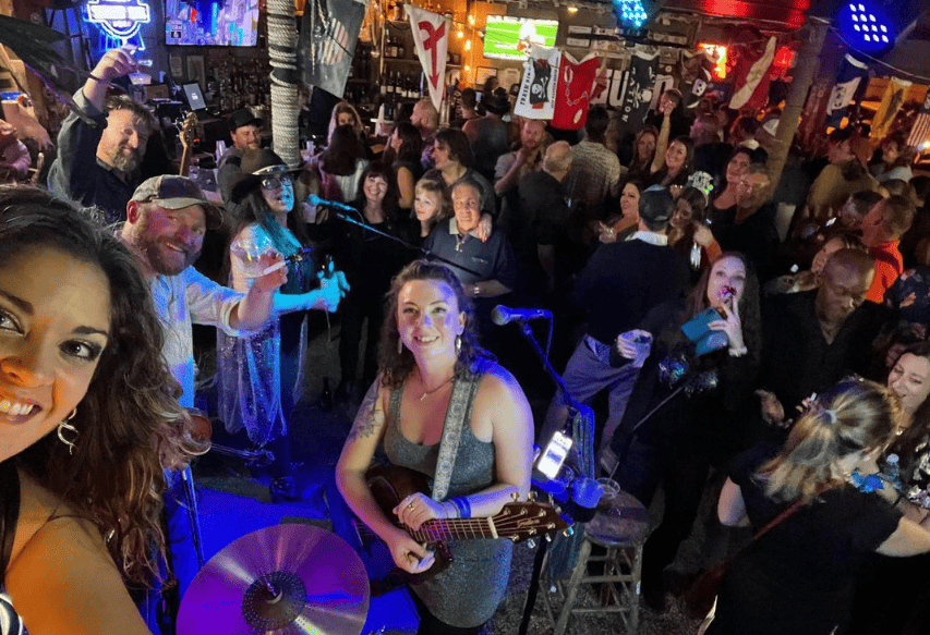Selfie taken from inside The Saltwater Hippie beach bar by a musician in a packed house.