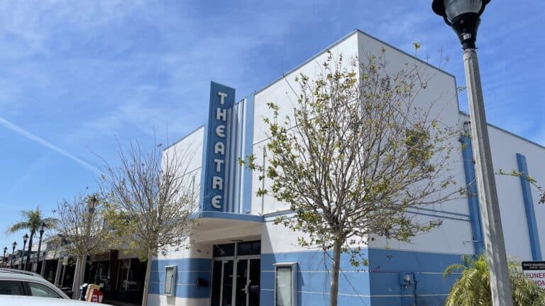 exterior of a movie theatre with a blue and white paint job