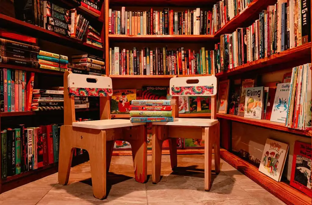 two children's chairs surrounded by children's books