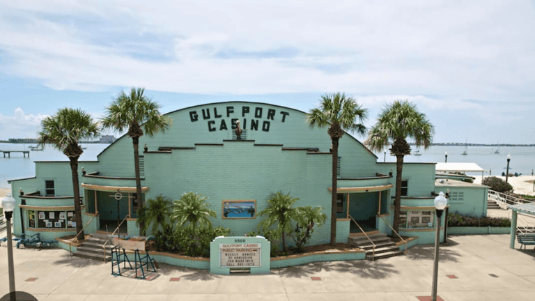 exterior of an events venue. It has a light blue paint job and the words "Gulfport Casino" appear at the top
