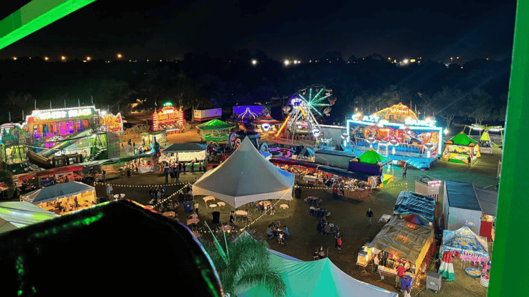 aerial view of a carnival at night from a ferries wheel