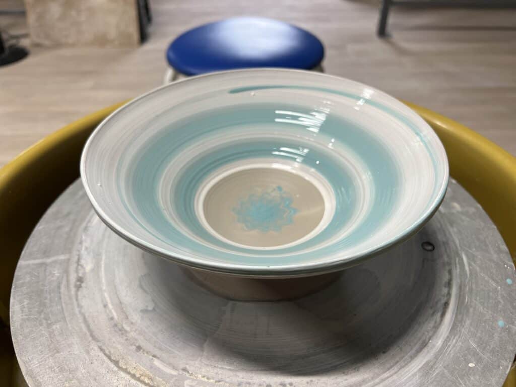 clay bowl on throwing wheel.