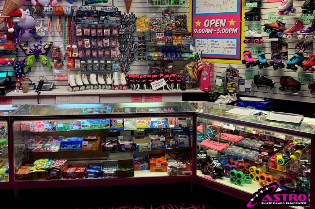 glass counter filled with candy and roller skate accessories.