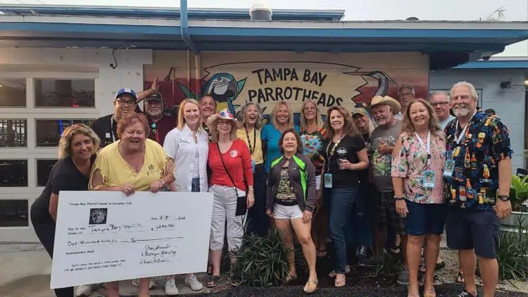 a group of people present a large donation to a non profit