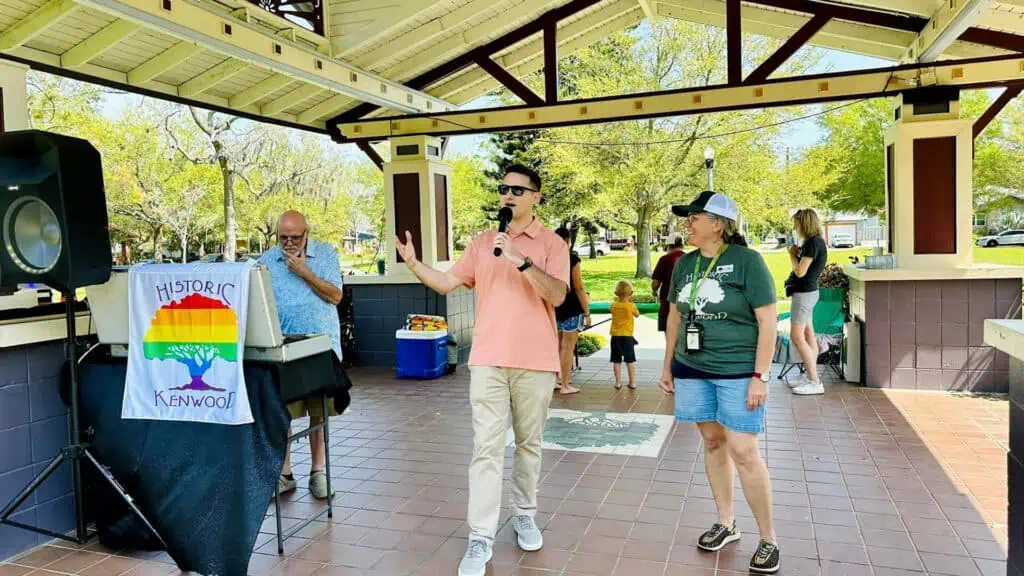 representative speaks during a celebration at a local park 