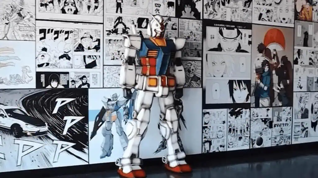 a large robot sculpture next to a wall covered in anime