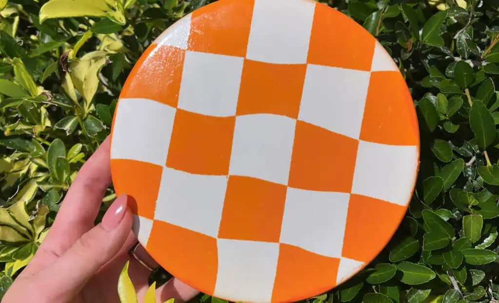 orange and white checkerboard pattern disc 