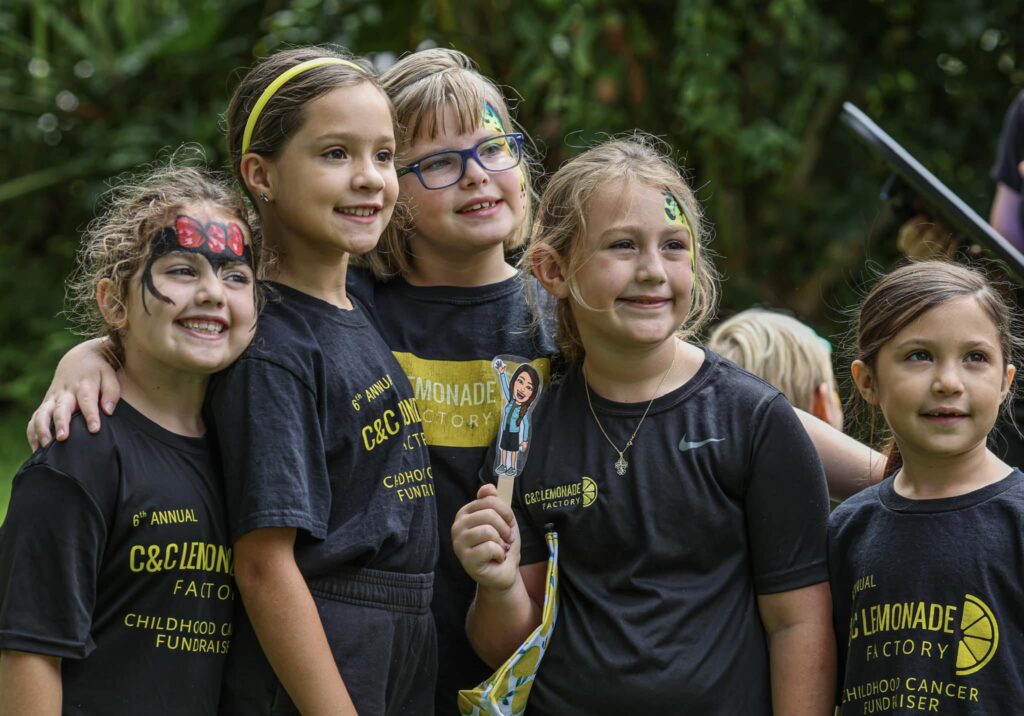 children wearing black t-shirts at annual fundraiser