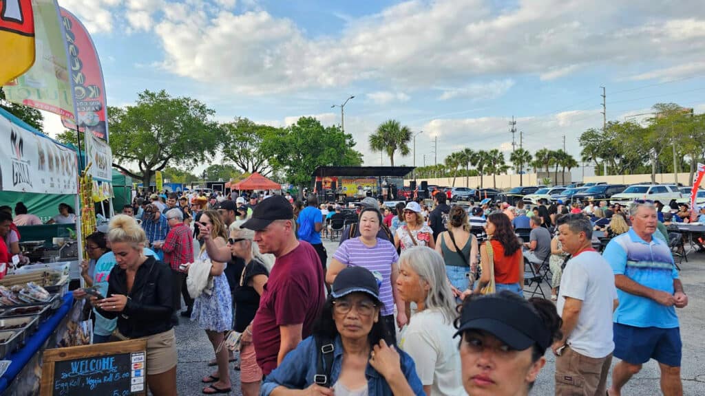 people wait in line at a big food festival in St. Pete